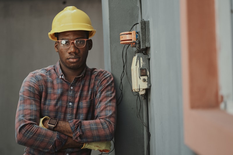 Residential plumber fixing kitchen sink pipes